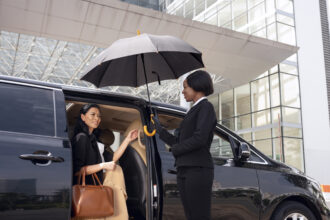 businesswoman-getting-taxi-cab