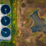 Sewage Treatment Plant near a nature reserve and the ocean in Denmark. Environmental conservation and preservation of clean waters resources is high priority and the Scandinavian countries are at the forefront in development of sustainable solutions for waste water treatment to secure a clean earth for future generations. Besides the waste products are recycled for energy production as green biofuel ultimately leading to decreased CO2 emission, global warming and climate change.